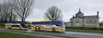 Coach in front of distant Church